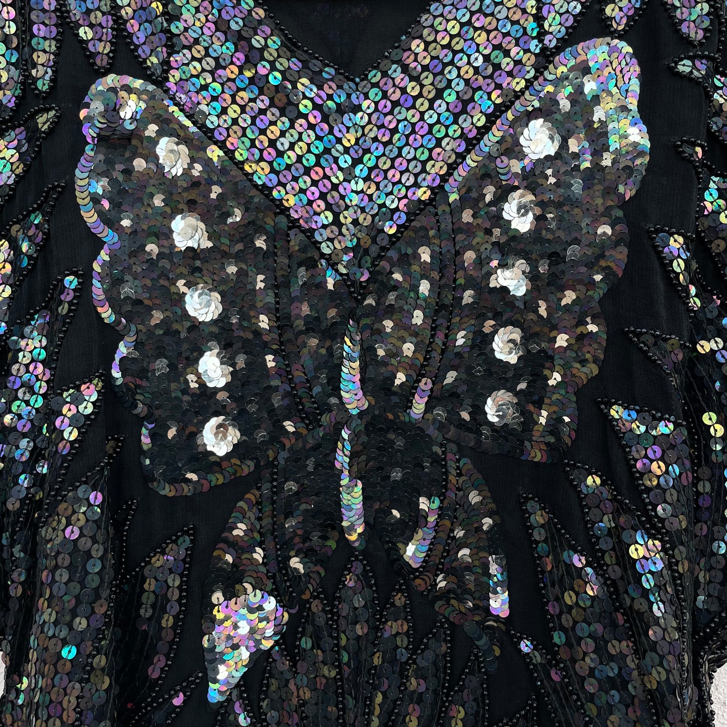 Top paillettes farfalla