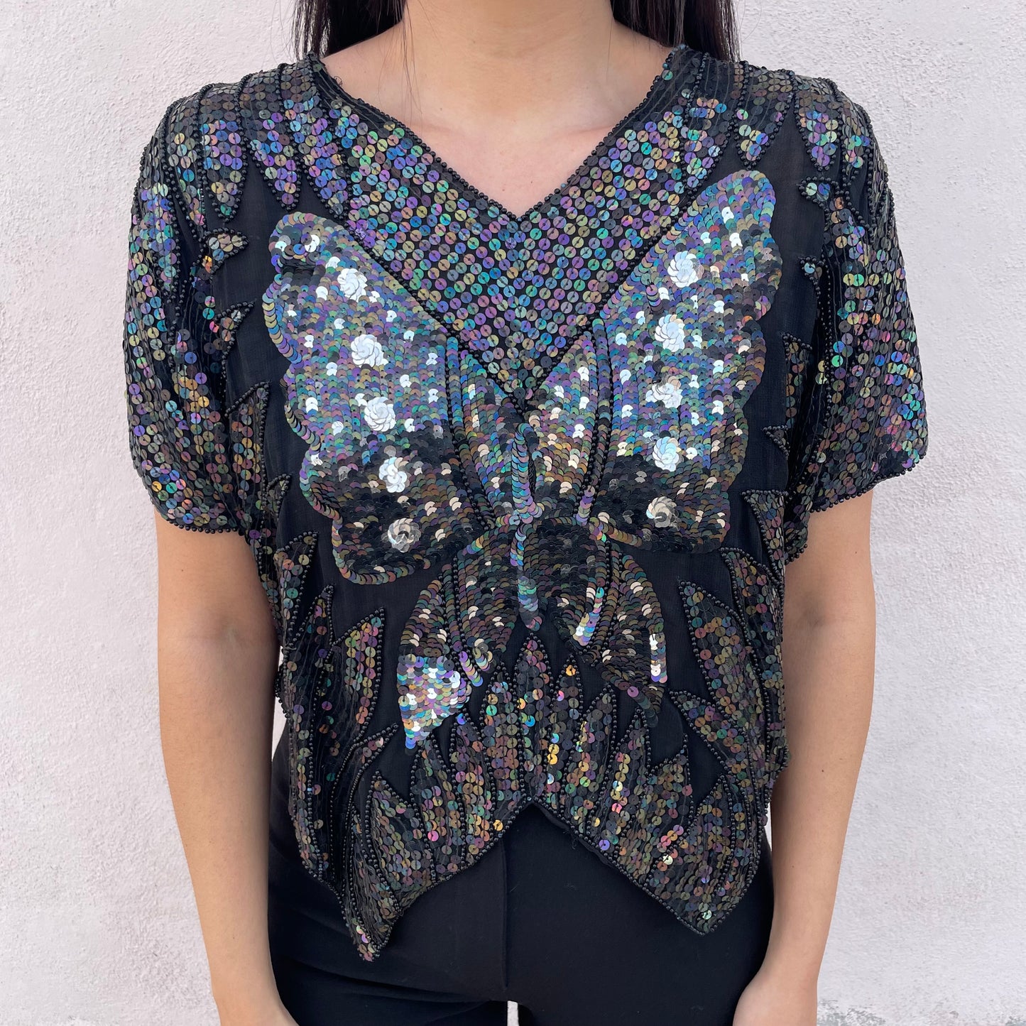 Top paillettes farfalla