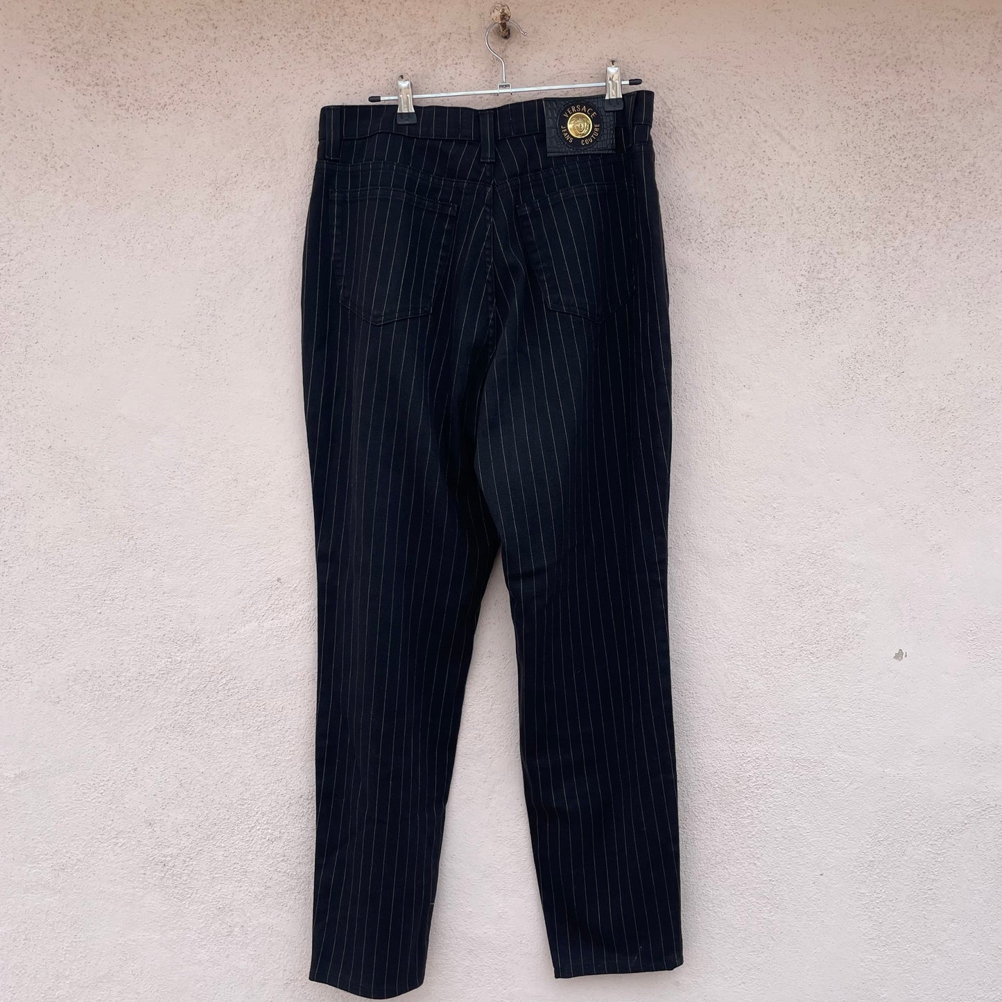 Jeans gessati Versace