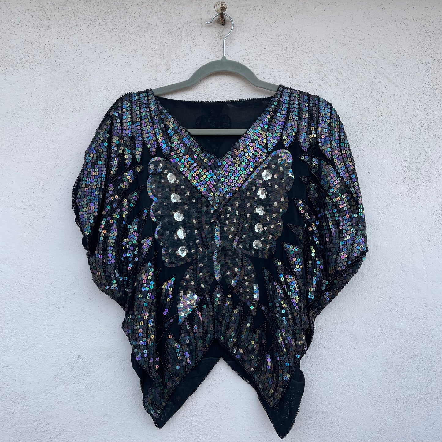 Top paillettes farfalla
