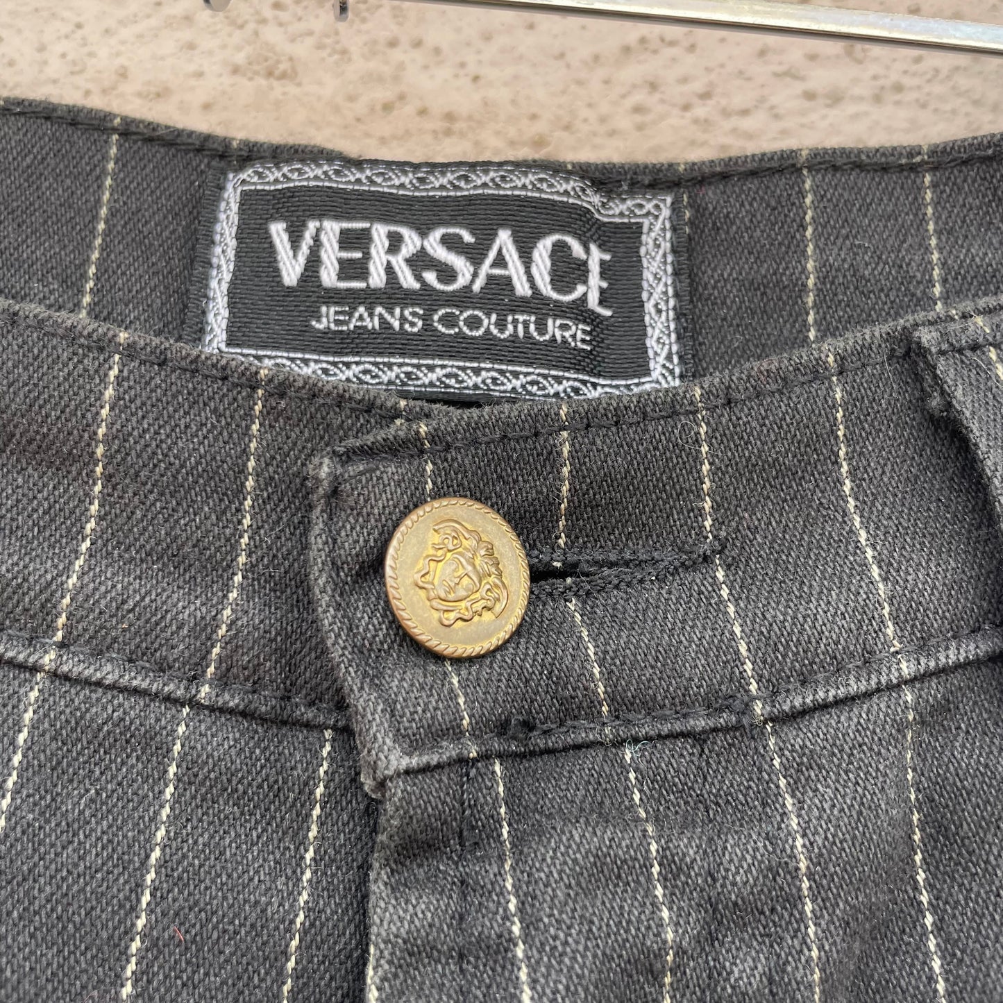 Jeans gessati Versace